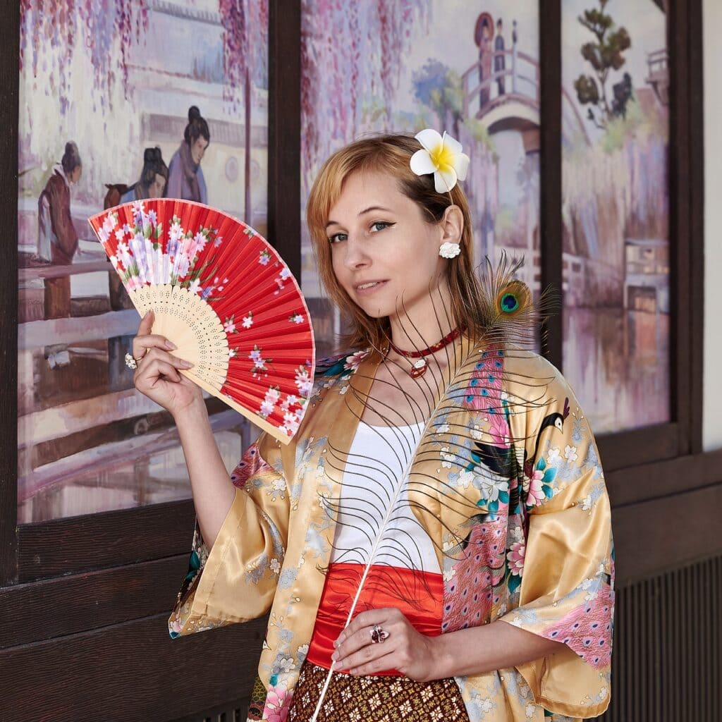 Woman keeping cool with fan