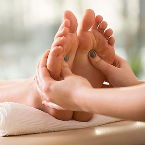 Reflexology being performed on the feet